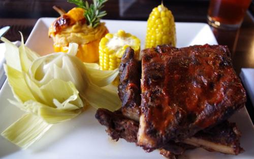 Dry rubbed pork spare ribs braised in apple cider and grilled with house-made BBQ sauce served with corn on the cob and pumpkin mashed potatoes